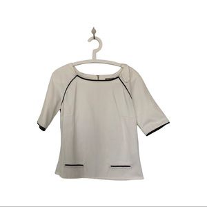 NWOT - White top with black vegan leather piping.